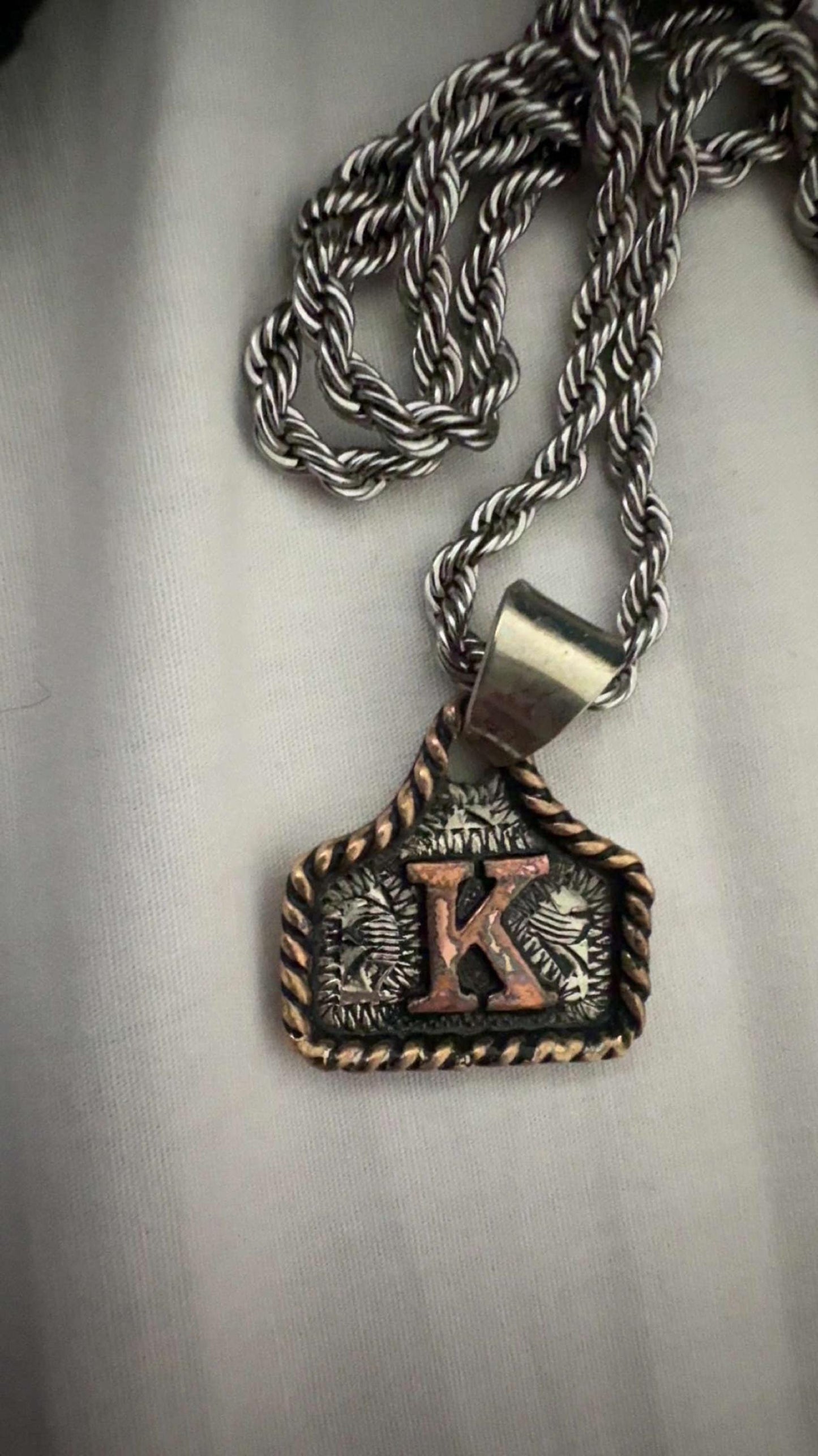 Cow Tag Necklace Handmade Personalized Initial Necklace, Handcrafted. Small Model. Comes with a 23" Stainless Steel Chain.