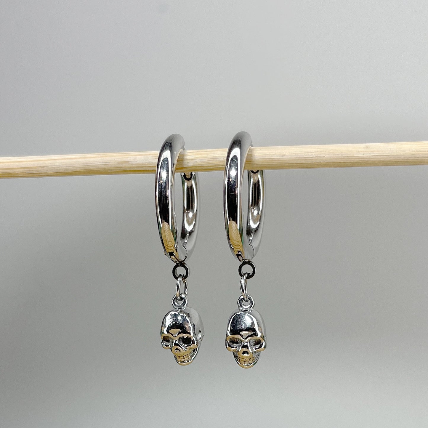 Pair of 316L Surgical Steel Hoop Earrings with Skull Dangle • 20ga