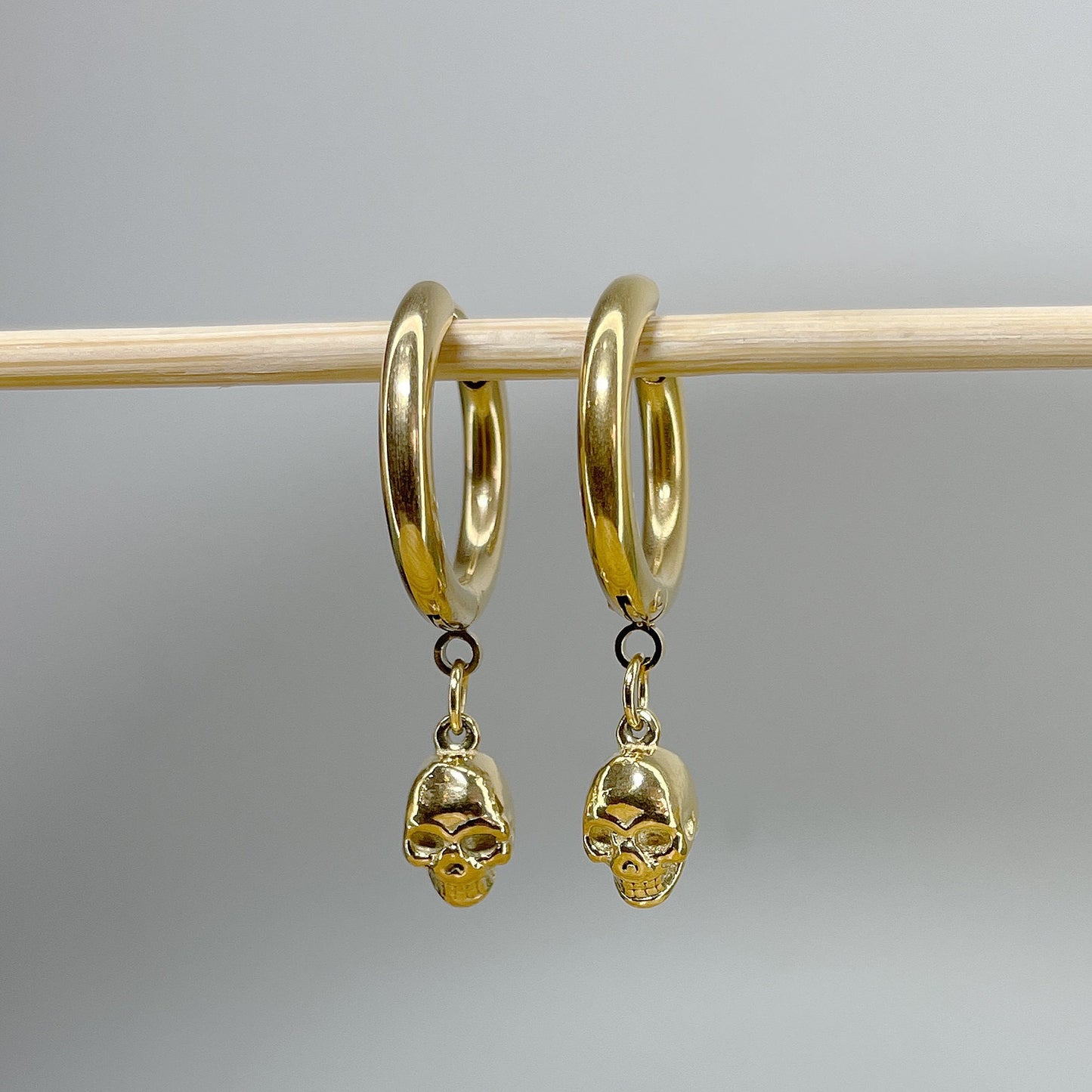 Pair of 316L Surgical Steel Hoop Earrings with Skull Dangle • 20ga